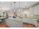 Spacious kitchen with a center island, stainless steel appliances, and ample cabinet space for storage at 4035 W Sandy Trl, Fort Mill, SC 29707