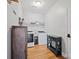 Functional laundry room equipped with a washer, dryer, storage cabinet, and a folding table at 4035 W Sandy Trl, Fort Mill, SC 29707
