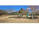 Charming community playground with swings, a slide, picnic table, and a gazebo at 4035 W Sandy Trl, Fort Mill, SC 29707
