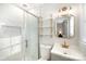 Bright bathroom features marble shower, gold accents, and updated vanity at 4136 Woodgreen Ter, Charlotte, NC 28205