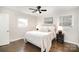 Cozy bedroom with plush bedding, dark wood floors, and neutral decor at 4136 Woodgreen Ter, Charlotte, NC 28205