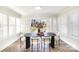 Bright dining room features white shutters, wood floors, and modern decor at 4136 Woodgreen Ter, Charlotte, NC 28205