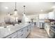 Spacious kitchen with stainless appliances, granite countertops, and breakfast bar at 4136 Woodgreen Ter, Charlotte, NC 28205