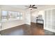 Bright living room features hardwood floors, large windows, and French doors at 4136 Woodgreen Ter, Charlotte, NC 28205