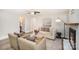 Comfortable living room with a decorative fireplace, wood floors, and recessed lighting at 4136 Woodgreen Ter, Charlotte, NC 28205