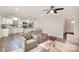Open concept living room with a view of the modern kitchen and stainless appliances at 4136 Woodgreen Ter, Charlotte, NC 28205
