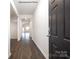 Spacious entry hallway with dark hardwood floors leading into an open-concept home at 5231 Reedy Ridge Rd, Charlotte, NC 28215