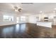 Hardwood floors in the living area offer ample space and connect to the kitchen at 5231 Reedy Ridge Rd, Charlotte, NC 28215