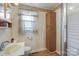 Functional bathroom features a vanity sink and a shower with a glass door at 602 Dallas Spencer Mountain Rd, Dallas, NC 28034