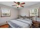 Tranquil bedroom with a ceiling fan, two windows and hardwood floors at 602 Dallas Spencer Mountain Rd, Dallas, NC 28034