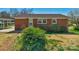 Brick home with manicured bushes and a covered carport providing convenient parking at 602 Dallas Spencer Mountain Rd, Dallas, NC 28034