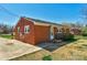 Classic brick home with well-kept lawn, featuring a welcoming entrance and tidy landscaping at 602 Dallas Spencer Mountain Rd, Dallas, NC 28034