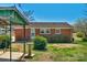 Quaint brick home with well-maintained lawn, showcasing a neat and inviting exterior at 602 Dallas Spencer Mountain Rd, Dallas, NC 28034