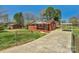 Well-maintained brick home with a long driveway and a carport providing ample parking at 602 Dallas Spencer Mountain Rd, Dallas, NC 28034