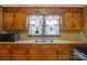 Functional kitchen with a stainless steel sink and wood cabinets at 602 Dallas Spencer Mountain Rd, Dallas, NC 28034