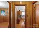 Living room featuring wood paneling and hardwood floors at 602 Dallas Spencer Mountain Rd, Dallas, NC 28034