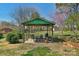 Covered patio with outdoor seating and grill, great for entertaining in the backyard at 602 Dallas Spencer Mountain Rd, Dallas, NC 28034