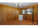 Well lit room featuring wood paneling and updated appliances at 602 Dallas Spencer Mountain Rd, Dallas, NC 28034