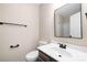 Bathroom featuring a vanity with towel rack, a toilet, and framed mirror at 6134 Meadow Rose Ln, Charlotte, NC 28215