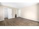 Large bedroom with neutral walls, a door to a closet, and access to the bathroom at 6134 Meadow Rose Ln, Charlotte, NC 28215