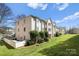 Multi-Gathering building with lush lawn, charming balconies, and mature landscaping at 6134 Meadow Rose Ln, Charlotte, NC 28215