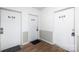 Apartment hallway featuring multiple white doors leading to different units at 6134 Meadow Rose Ln, Charlotte, NC 28215