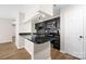 Modern kitchen featuring black cabinets, granite countertops, and stainless steel appliances at 6134 Meadow Rose Ln, Charlotte, NC 28215