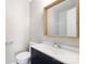 Bathroom features a vanity with a framed mirror at 6142 Meadow Rose Ln, Charlotte, NC 28215