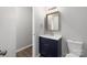 Bathroom features a vanity with a framed mirror at 6142 Meadow Rose Ln, Charlotte, NC 28215