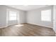 Bedroom with natural light and plank flooring at 6142 Meadow Rose Ln, Charlotte, NC 28215