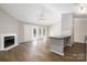 Bright living room features a fireplace and access to a patio at 6142 Meadow Rose Ln, Charlotte, NC 28215