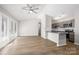 A living room with a ceiling fan leads into the kitchen at 6142 Meadow Rose Ln, Charlotte, NC 28215