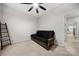 Bright bedroom features a futon, ladder shelves, and soft carpeting for a comfortable, minimalist design at 6936 Colonial Garden Dr, Huntersville, NC 28078
