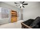 Cozy bedroom with natural light, a stylish futon, and charming wood accents for a relaxing retreat at 6936 Colonial Garden Dr, Huntersville, NC 28078