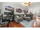 Spacious living room with hardwood floors, modern decor, and comfortable seating at 6936 Colonial Garden Dr, Huntersville, NC 28078
