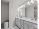 Bathroom featuring a double vanity with modern fixtures at 7217 Somerford Rd, Charlotte, NC 28215