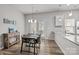 Bright dining area features a modern light fixture and a view to the yard at 7217 Somerford Rd, Charlotte, NC 28215