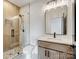 Modern bathroom featuring a glass enclosed shower and a wooden vanity at 733 Barbary Pl, Lincolnton, NC 28092