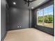 Contemporary bedroom with a large window, dark walls, and neutral flooring, creating a serene atmosphere at 733 Barbary Pl, Lincolnton, NC 28092