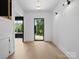 Sunlit foyer with light wood floors and a sleek, modern front door leading to an inviting entrance at 733 Barbary Pl, Lincolnton, NC 28092