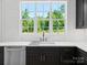 Kitchen sink with view, stainless steel appliances, and white backsplash at 733 Barbary Pl, Lincolnton, NC 28092