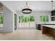 Bright kitchen with white backsplash, dark cabinets, and stainless-steel appliances at 733 Barbary Pl, Lincolnton, NC 28092