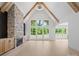 Bright living room featuring a stone fireplace, cathedral ceiling and lots of natural light at 733 Barbary Pl, Lincolnton, NC 28092