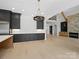 Open floorplan featuring a kitchen with an island, dark cabinets, and a living room with fireplace at 733 Barbary Pl, Lincolnton, NC 28092