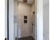 Modern shower with decorative accent wall, glass door, dual shower heads and decorative floor design at 733 Barbary Pl, Lincolnton, NC 28092
