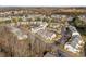 Aerial view of community with tree lined streets and mature landscaping at 7364 Laurel Valley Rd, Charlotte, NC 28273