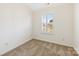 Bright bedroom features neutral carpet, white trim, plantation shutters, and ample natural light at 7364 Laurel Valley Rd, Charlotte, NC 28273