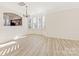 Dining room with laminate flooring and a view into the adjacent kitchen at 7364 Laurel Valley Rd, Charlotte, NC 28273