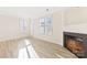 Inviting living room featuring a modern fireplace and bright natural light at 7364 Laurel Valley Rd, Charlotte, NC 28273
