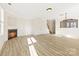 Bright living room with fireplace and light wood laminate floors at 7364 Laurel Valley Rd, Charlotte, NC 28273